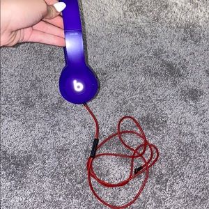 purple beats headphones with red cord